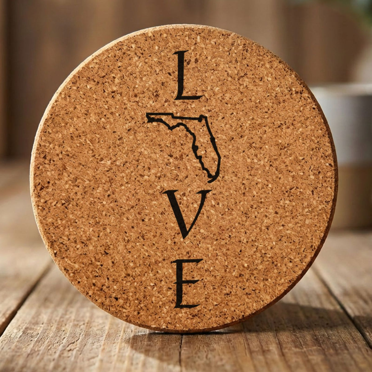 Florida round cork coaster engraved with LOVE stacked vertically using the state as the letter O