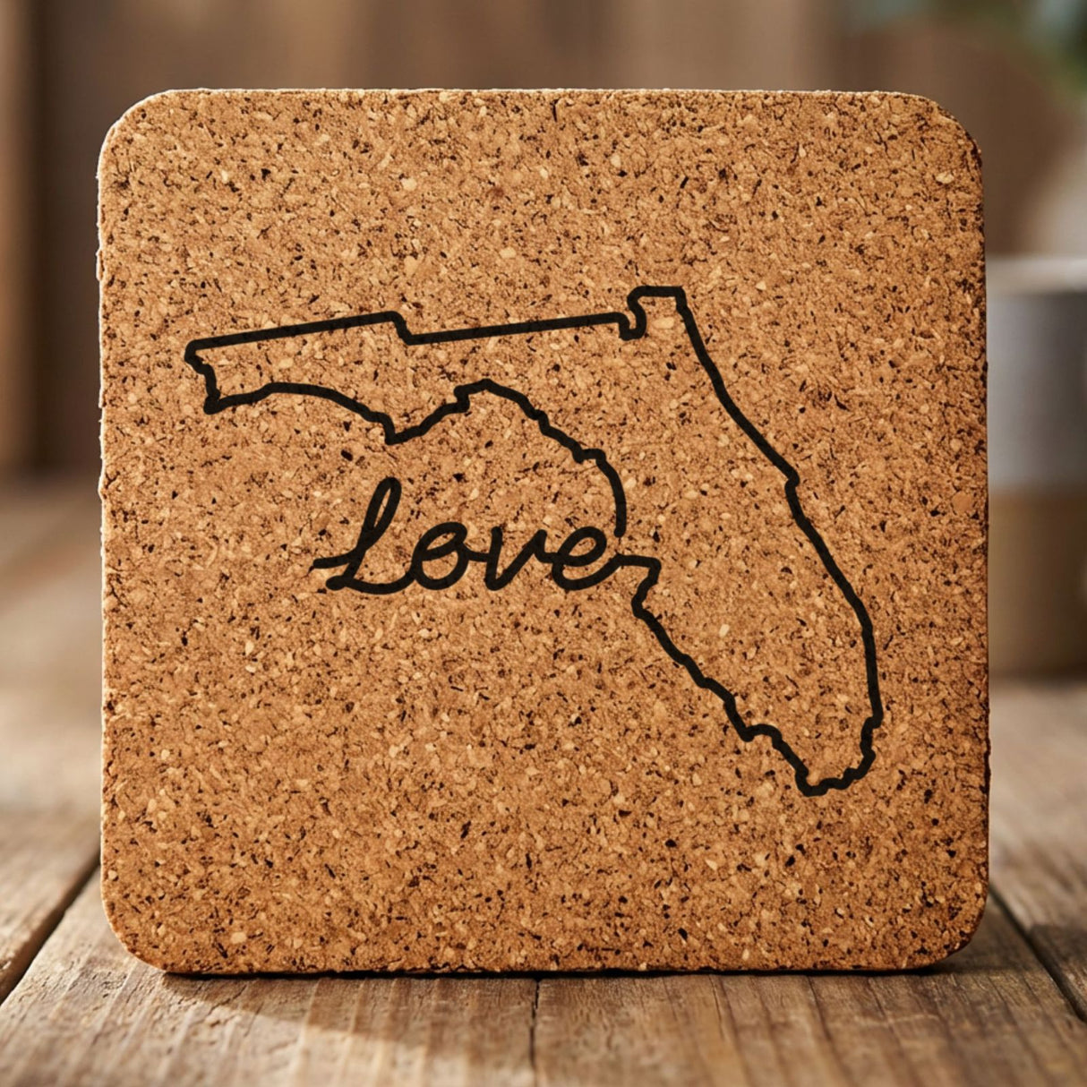 Florida square cork coaster engraved with a hand-drawn state outline and love in cursive