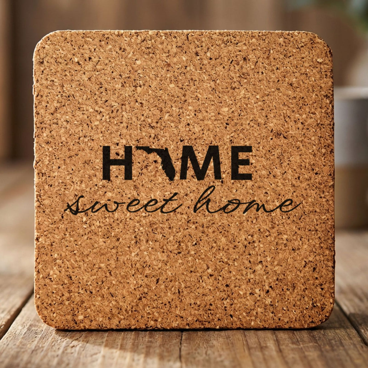 Florida square cork coaster engraved with HOME sweet home using the state shape as the letter O