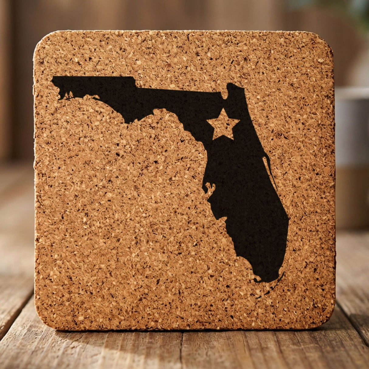 Florida square cork coaster engraved with the state shape and a star