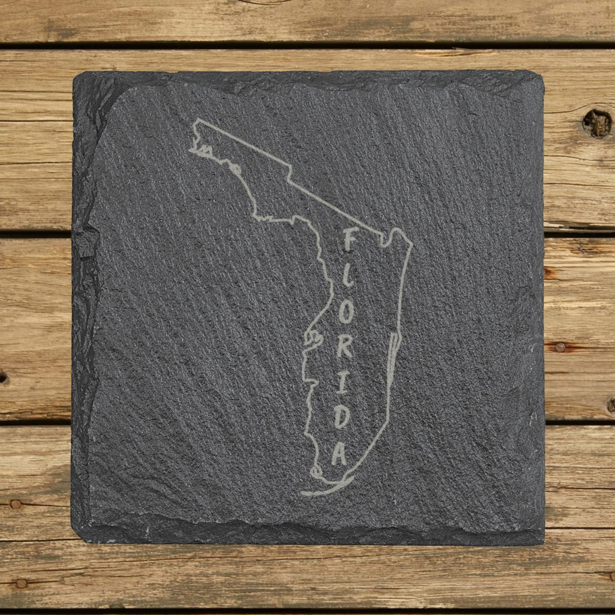 Florida square slate coaster engraved with the state outline and FLORIDA running vertically