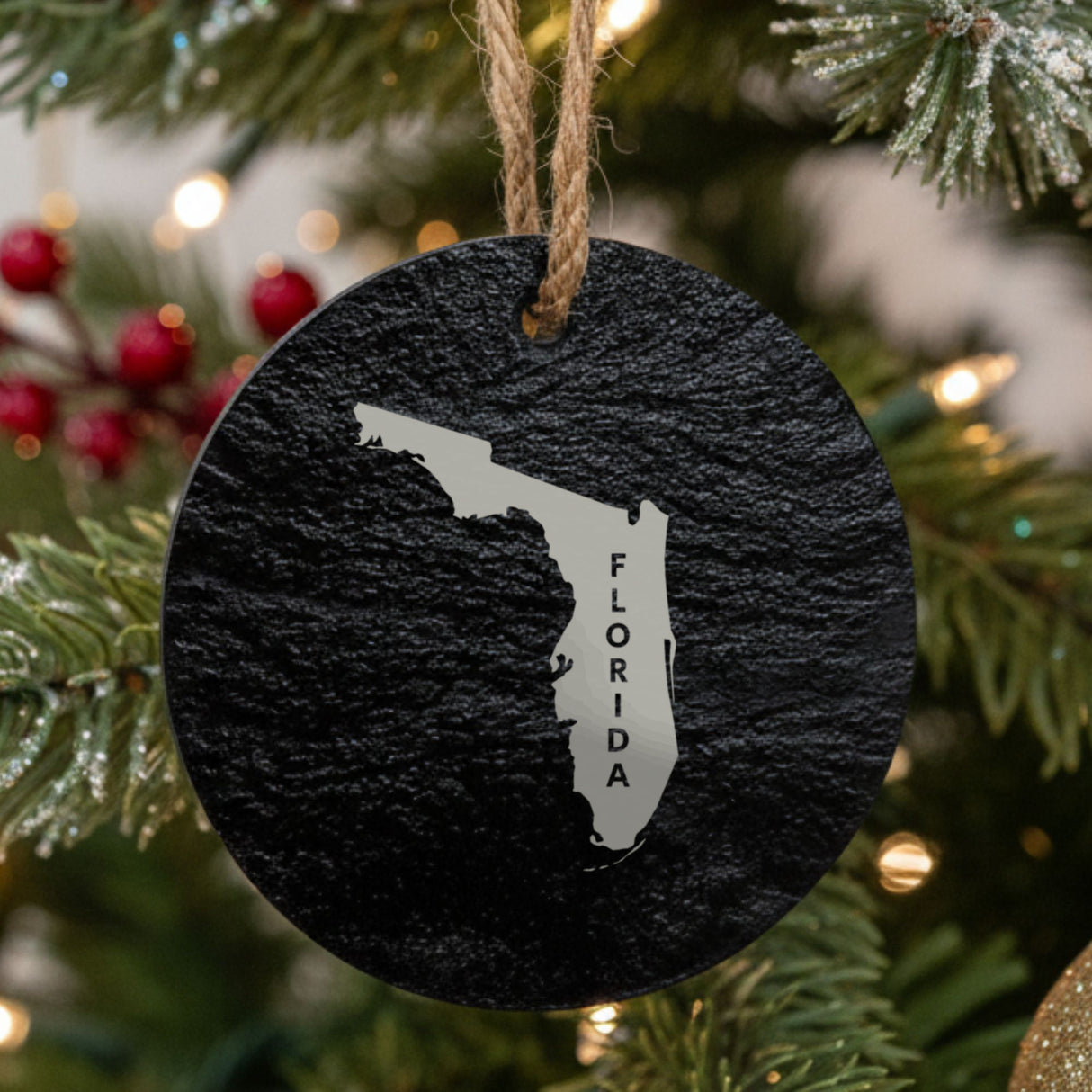 Florida round slate Christmas ornament engraved with the state shape and FLORIDA in vertical lettering