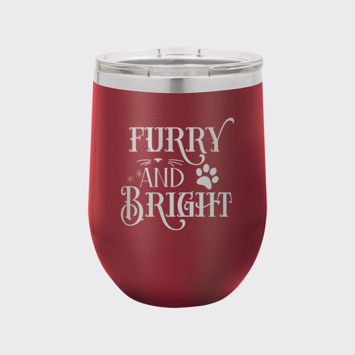 Maroon 12 oz stemless wine tumbler laser engraved with "Furry and Bright"