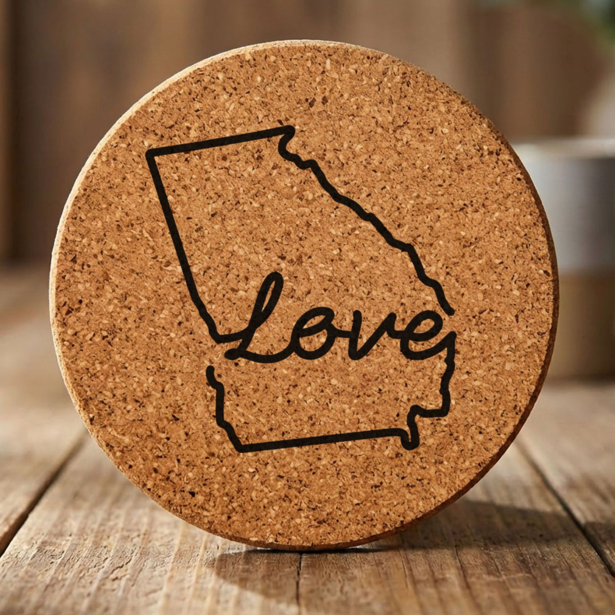 Georgia round cork coaster engraved with a hand-drawn state outline and love in cursive
