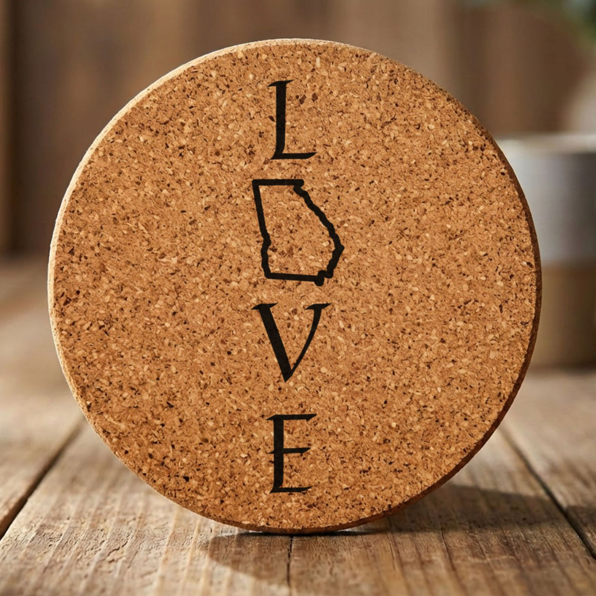 Georgia round cork coaster engraved with LOVE stacked vertically using the state as the letter O
