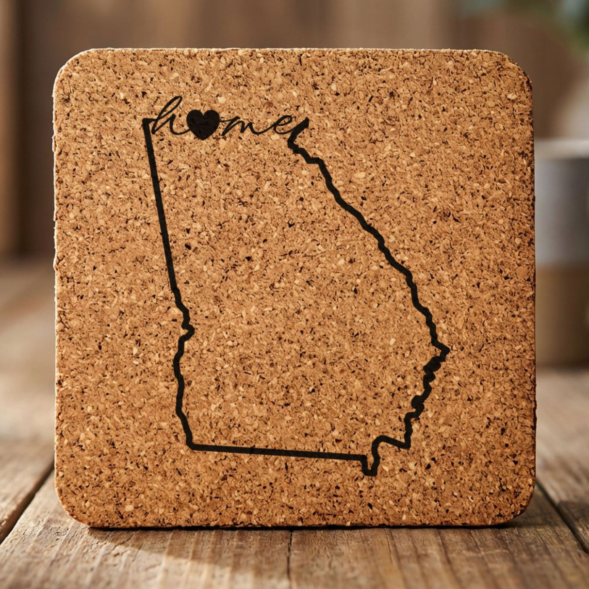 Georgia square cork coaster engraved with the state outline and home in script with a heart