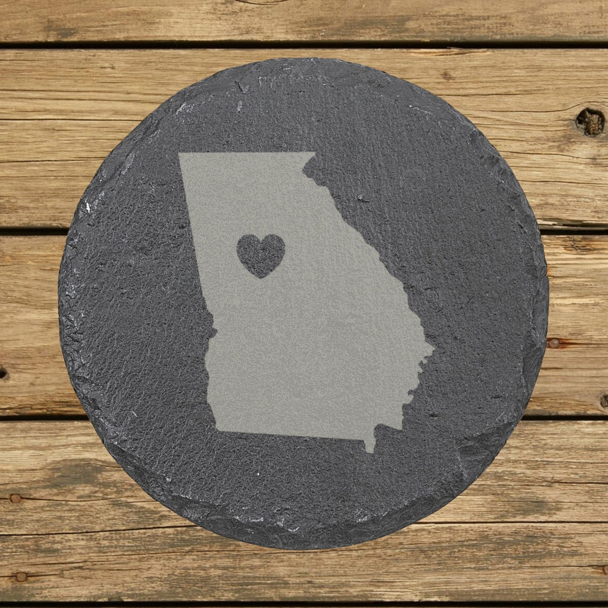 Georgia round slate coaster engraved with the state shape and a heart