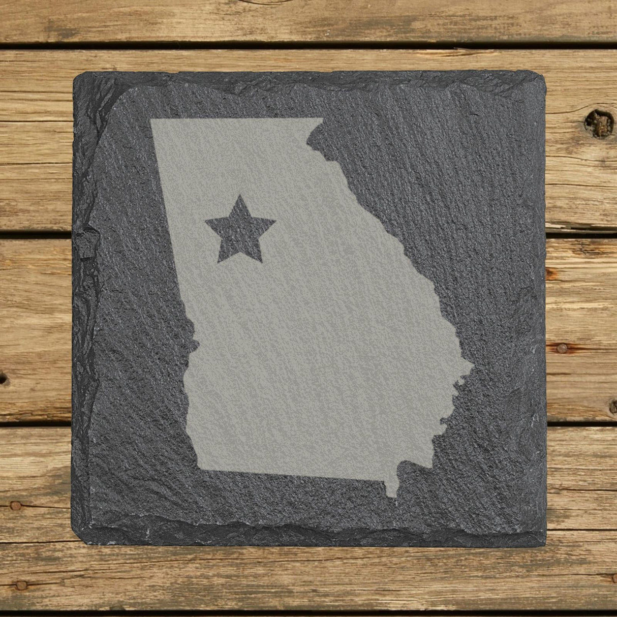 Georgia square slate coaster engraved with the state shape and a star