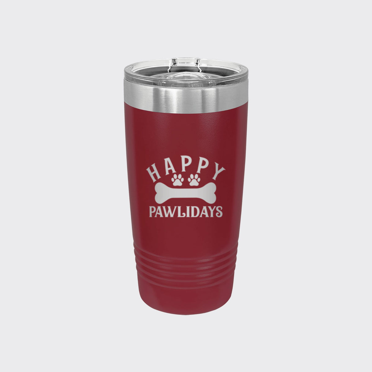 Maroon 20 oz tumbler laser engraved with "Happy Pawlidays"