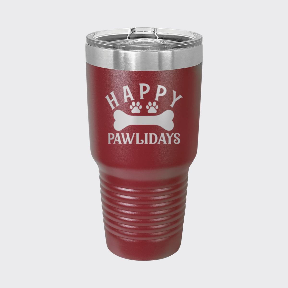 Maroon 30 oz tumbler laser engraved with "Happy Pawlidays"