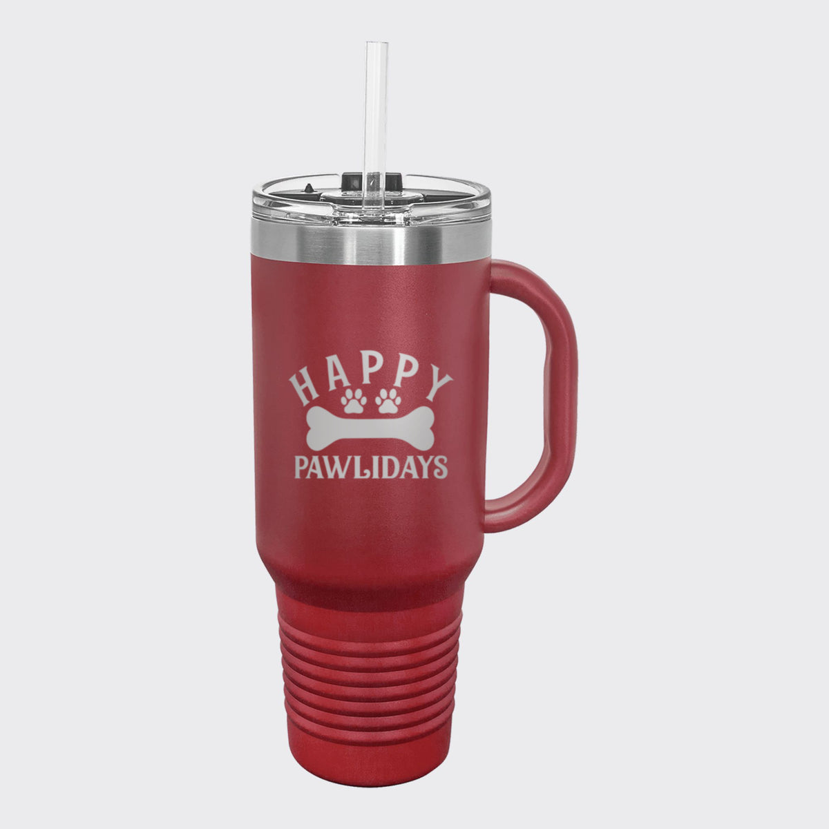 Maroon 40 oz tumbler with handle and straw laser engraved with "Happy Pawlidays"