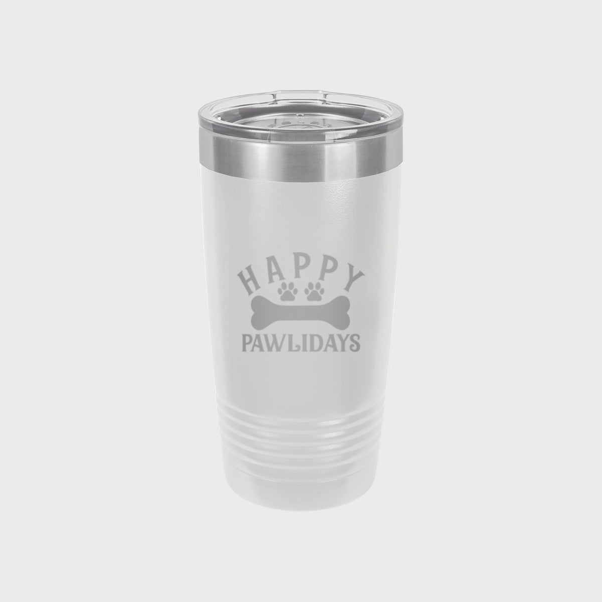 White 20 oz tumbler laser engraved with "Happy Pawlidays"