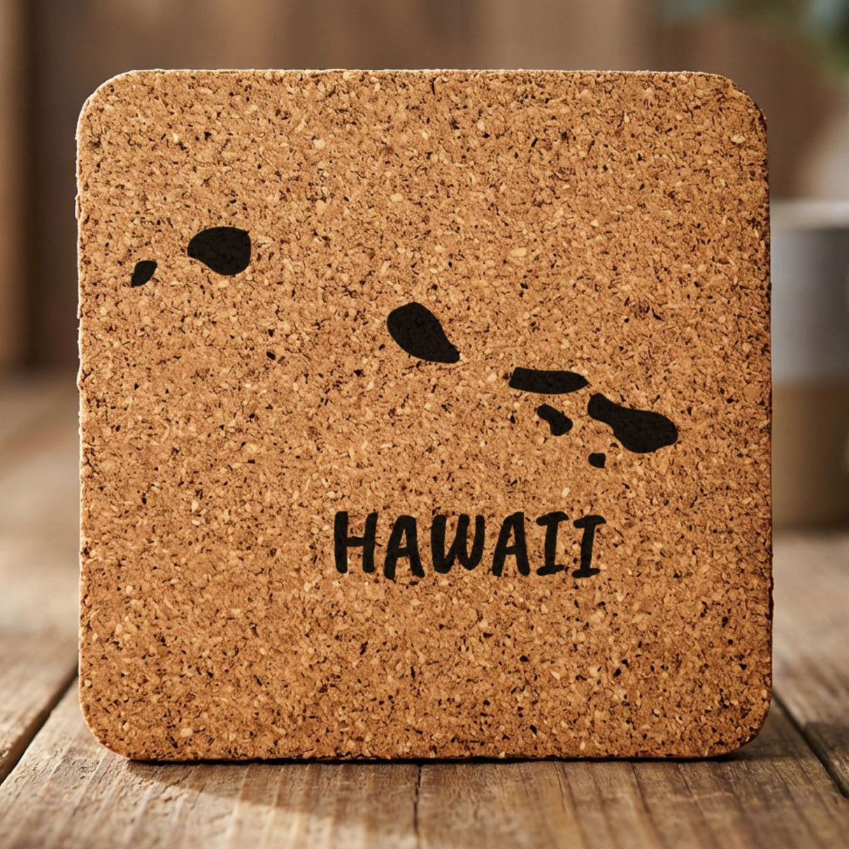 Hawaii square cork coaster engraved with the state outline and HAWAII in hand-drawn brush lettering