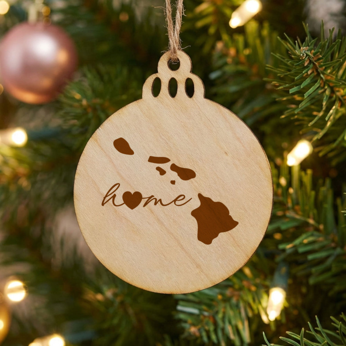 Hawaii round wood Christmas ornament engraved with the state outline and home in script with a heart