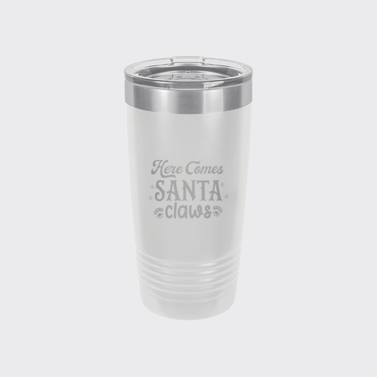 White 20 oz tumbler laser engraved with "Here Comes Santa Claws"