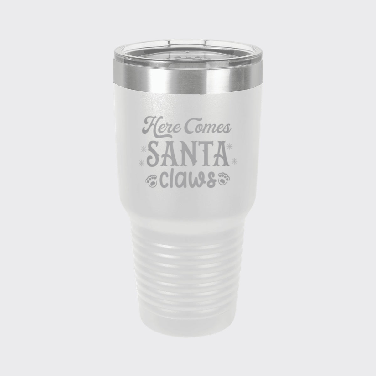White 30 oz tumbler laser engraved with "Here Comes Santa Claws"