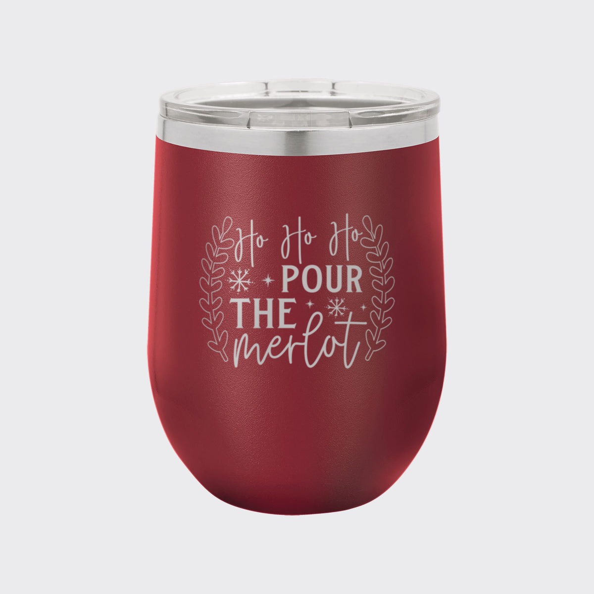 Maroon 12 oz stemless wine tumbler laser engraved with "Ho Ho Ho, Pour the Merlot"