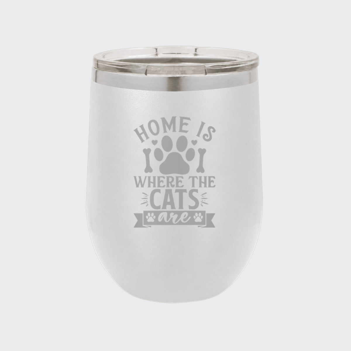 White 12 oz stemless wine tumbler laser engraved with "Home Is Where the Cats Are"