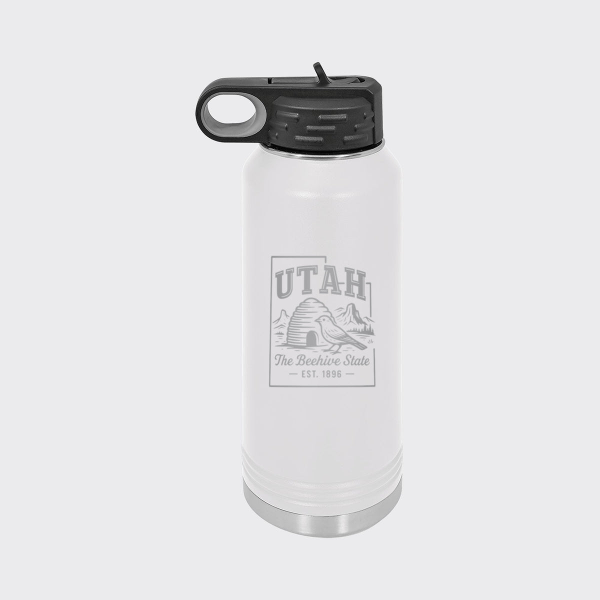 White 32 oz insulated water bottle laser engraved with a Utah design of a beehive, a California gull and red rock arches