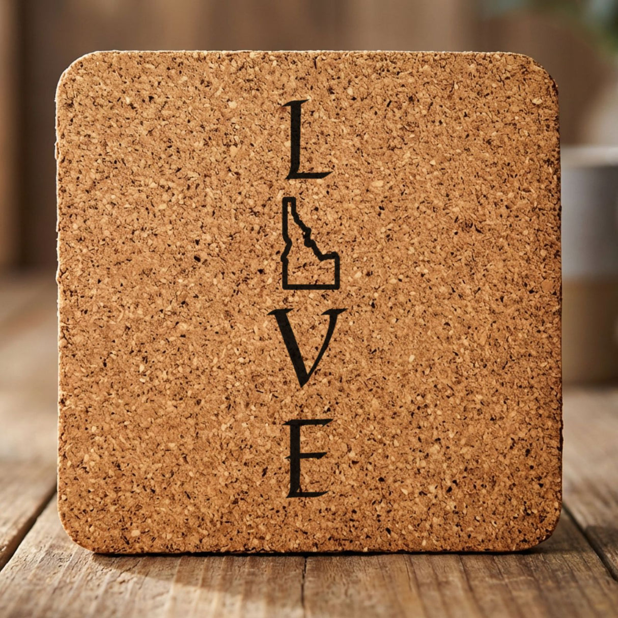 Idaho square cork coaster engraved with LOVE stacked vertically using the state as the letter O
