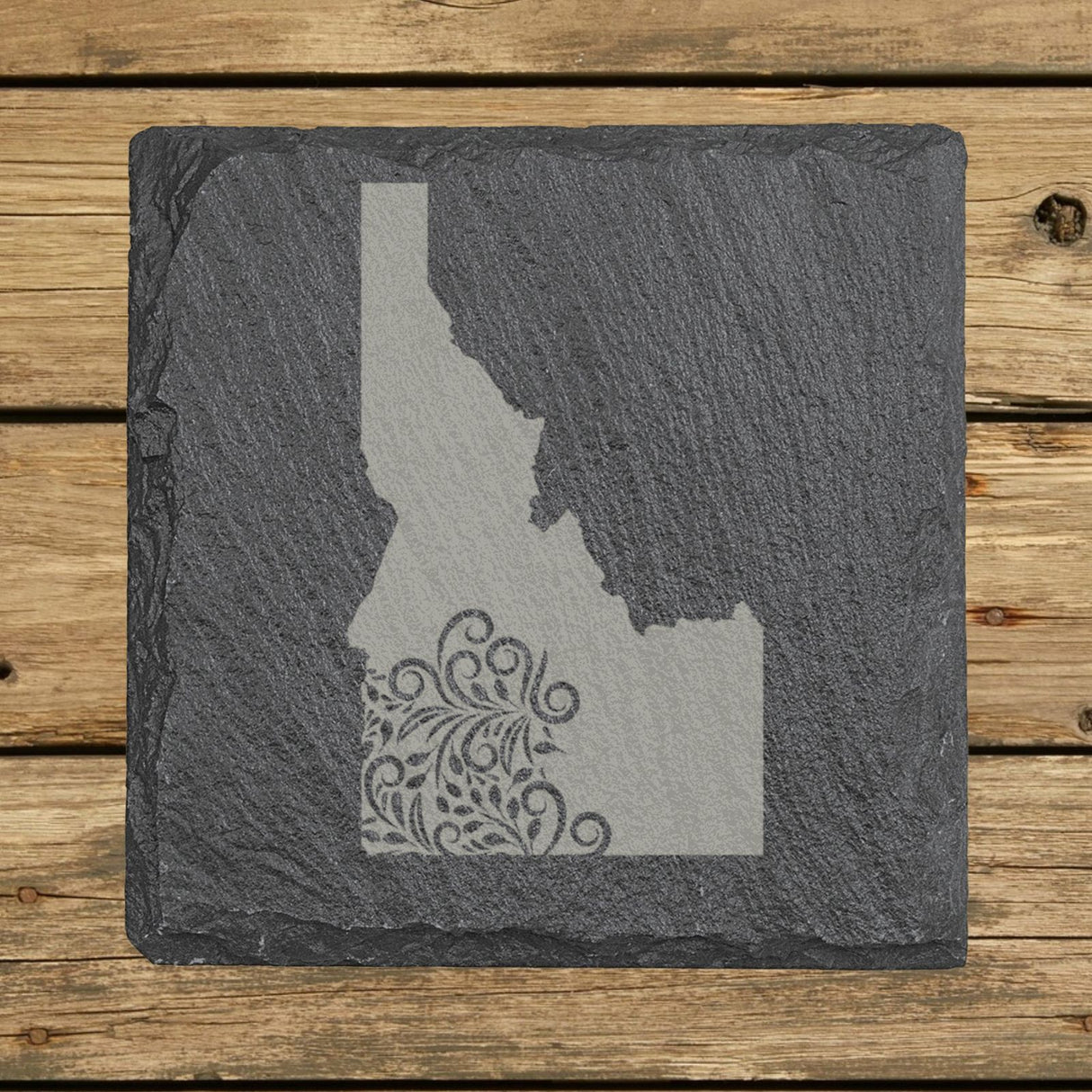 Idaho square slate coaster engraved with the state shape in ornate floral scrollwork