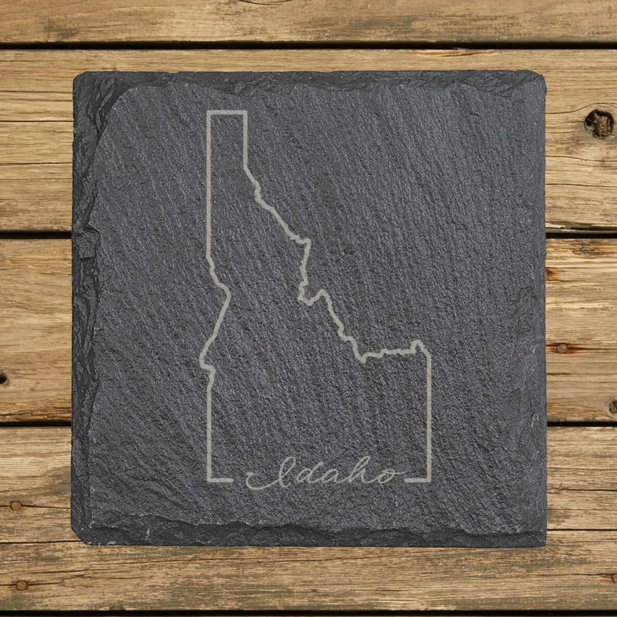 Idaho square slate coaster engraved with the state outline and Idaho in script lettering