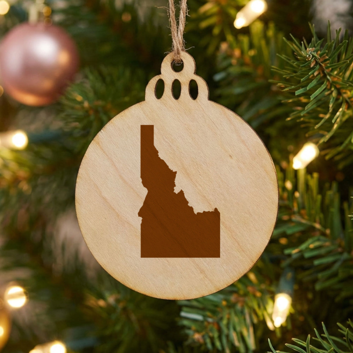 Idaho round wood Christmas ornament with the full state shape engraved