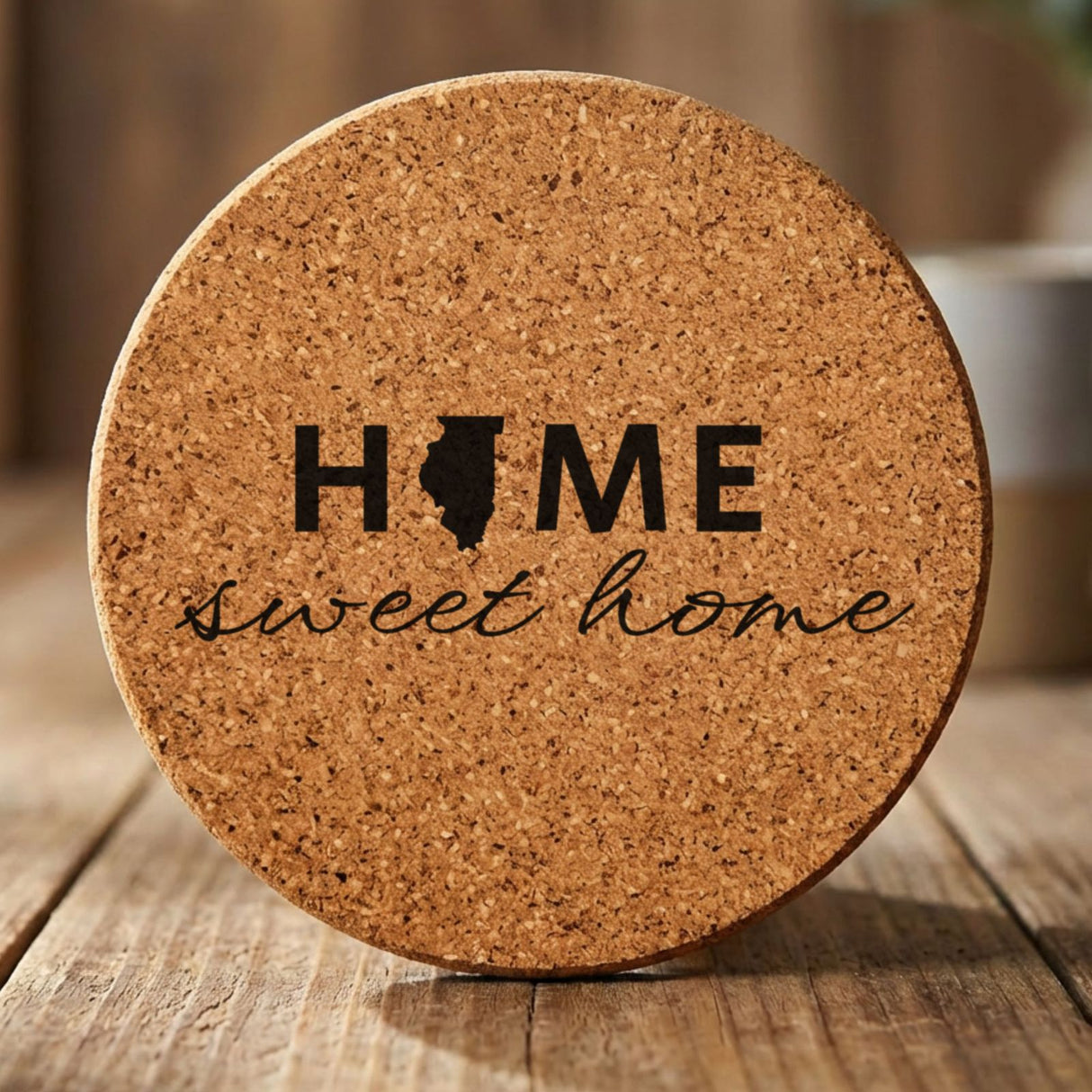 Illinois round cork coaster engraved with HOME sweet home using the state shape as the letter O