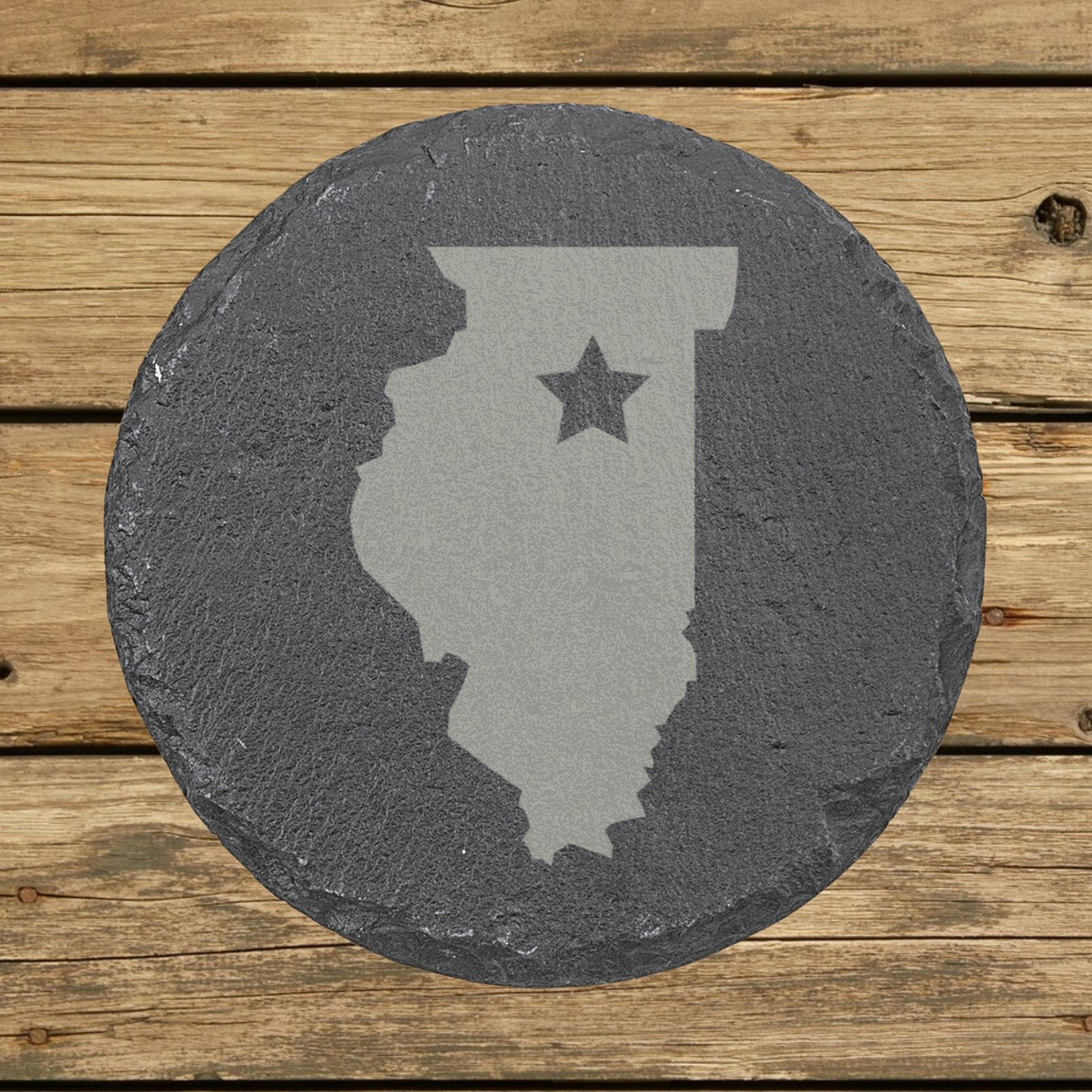 Illinois round slate coaster engraved with the state shape and a star