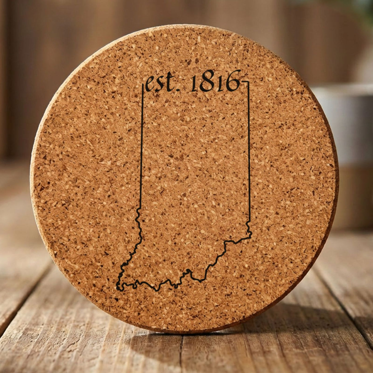 Indiana round cork coaster engraved with the state outline and est. 1816