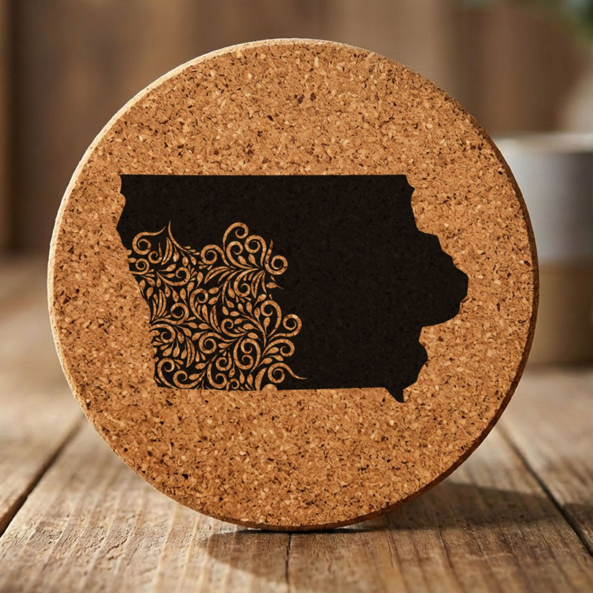 Iowa round cork coaster engraved with the state shape in ornate floral scrollwork