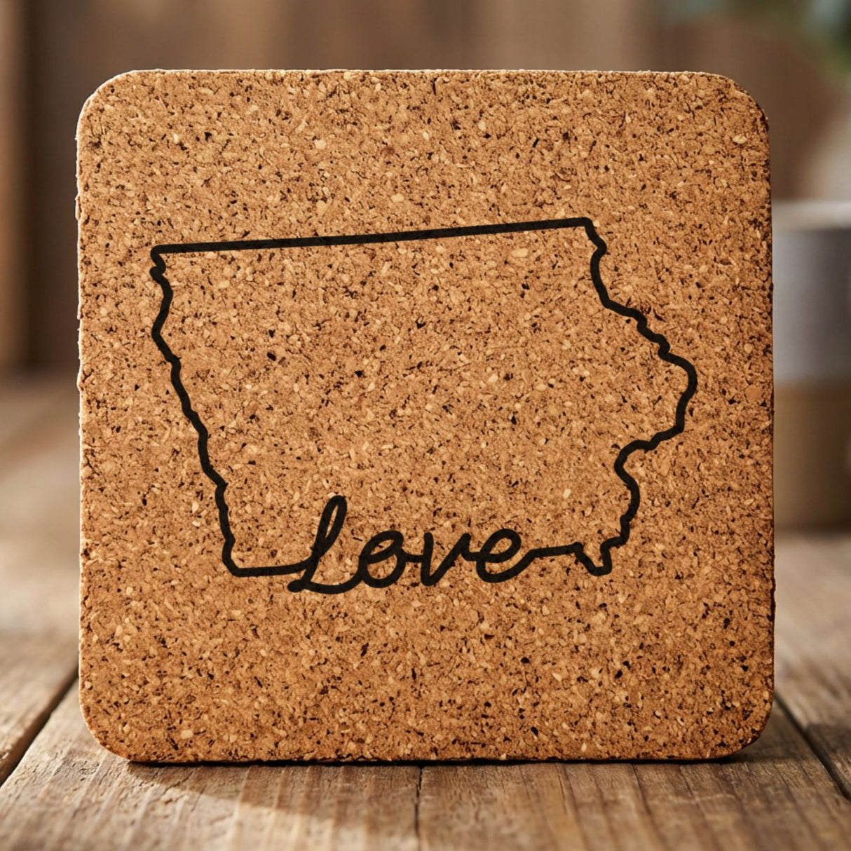 Iowa square cork coaster engraved with a hand-drawn state outline and love in cursive