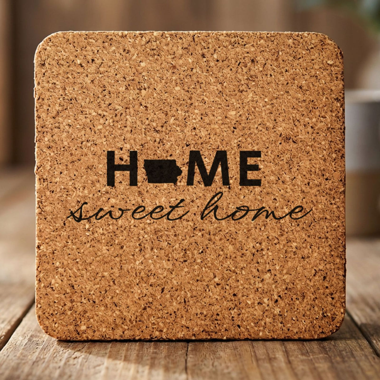 Iowa square cork coaster engraved with HOME sweet home using the state shape as the letter O