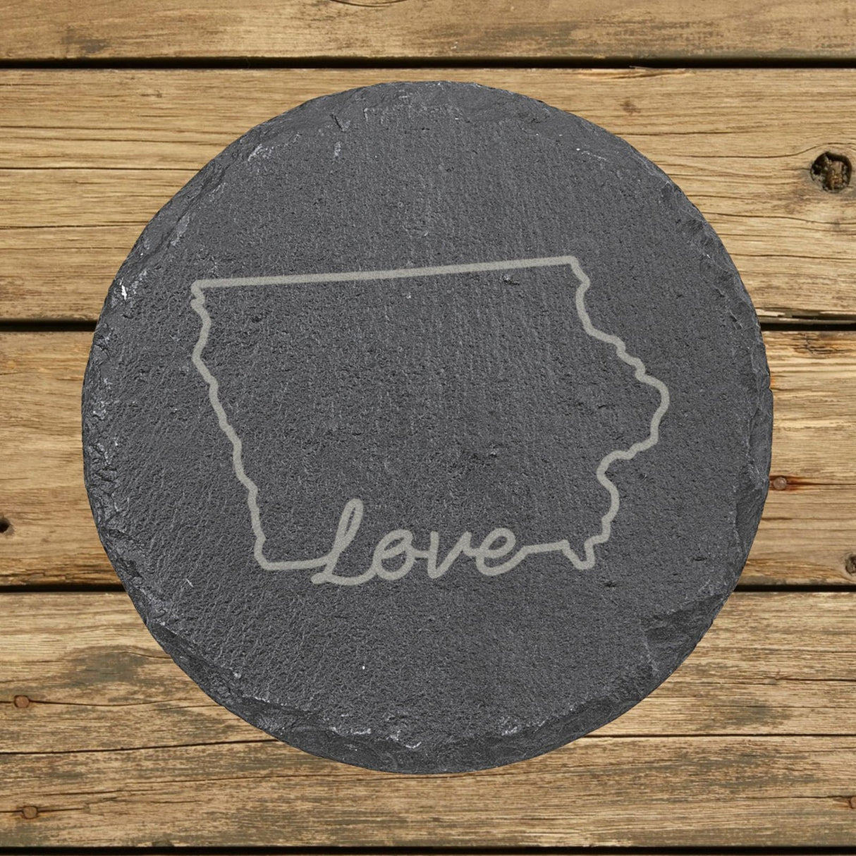 Iowa round slate coaster engraved with a hand-drawn state outline and love in cursive