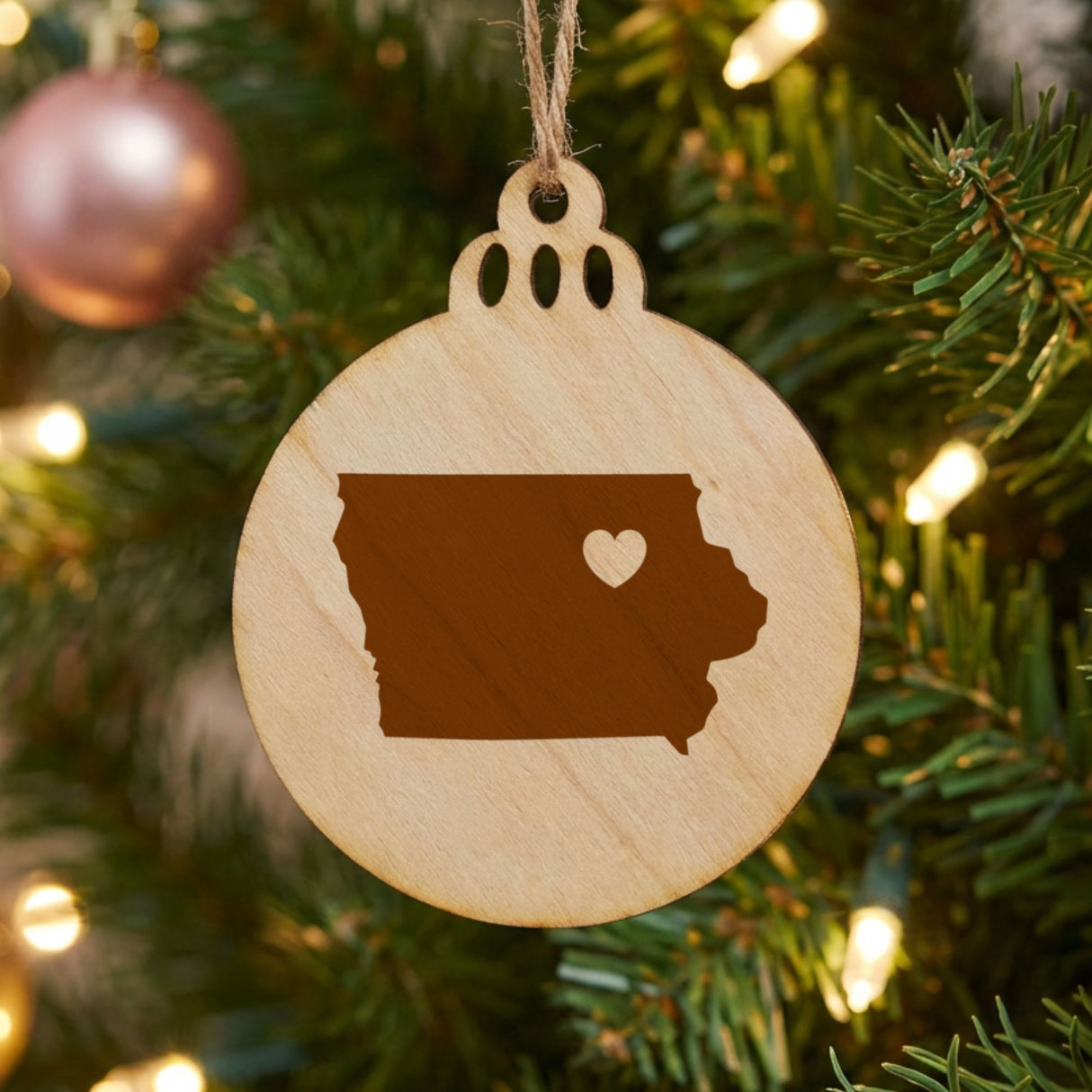 Iowa round wood Christmas ornament engraved with the state shape and a heart