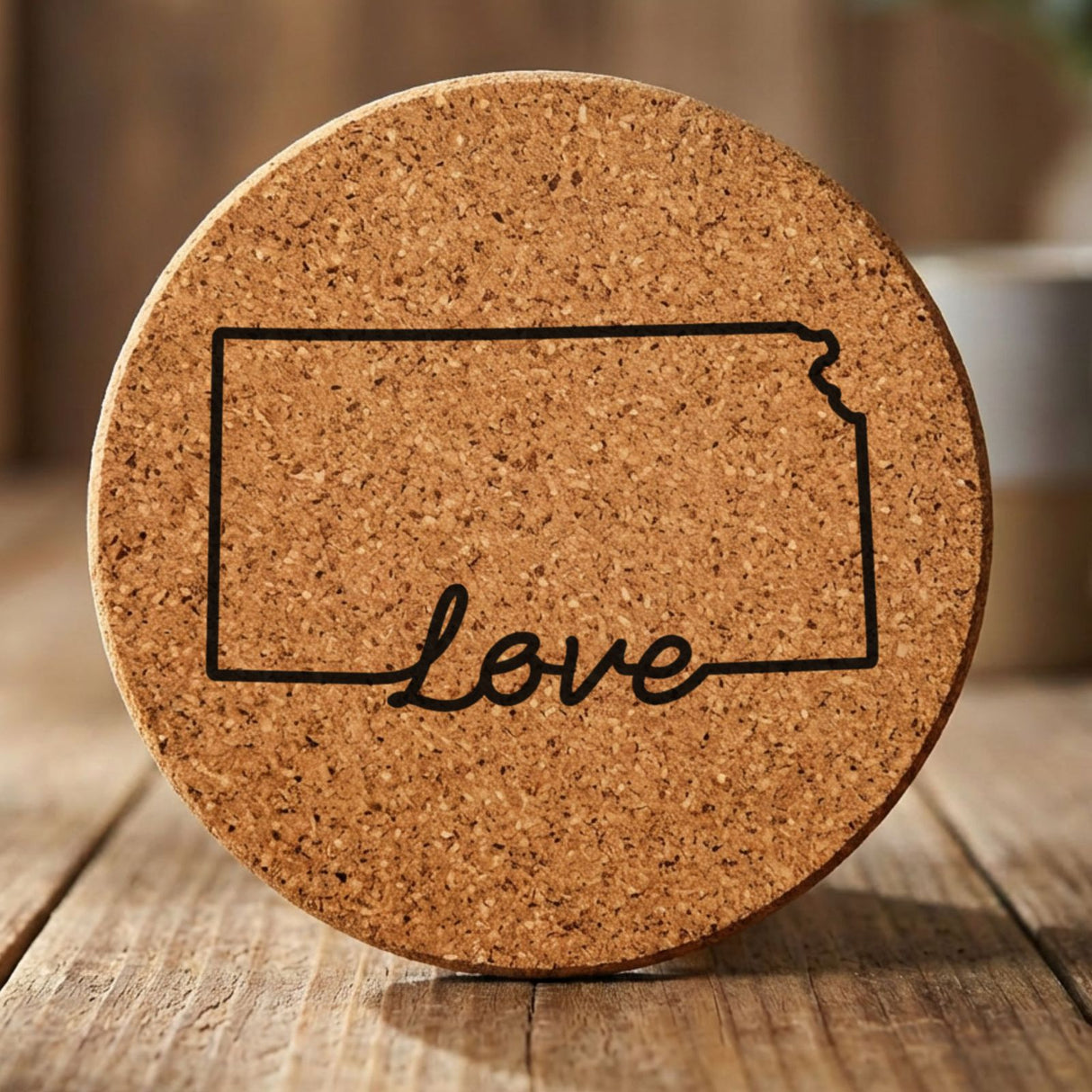Kansas round cork coaster engraved with a hand-drawn state outline and love in cursive