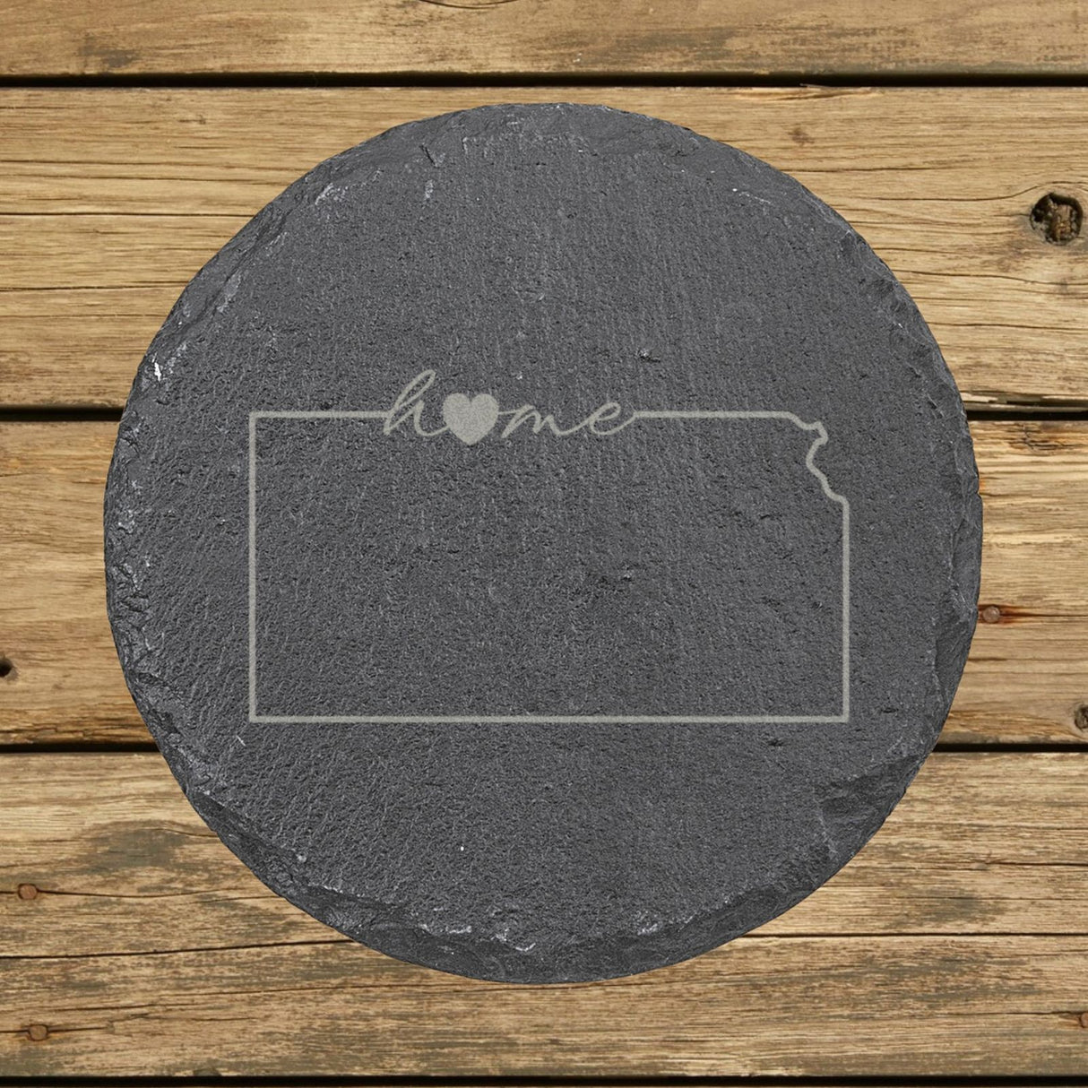 Kansas round slate coaster engraved with the state outline and home in script with a heart