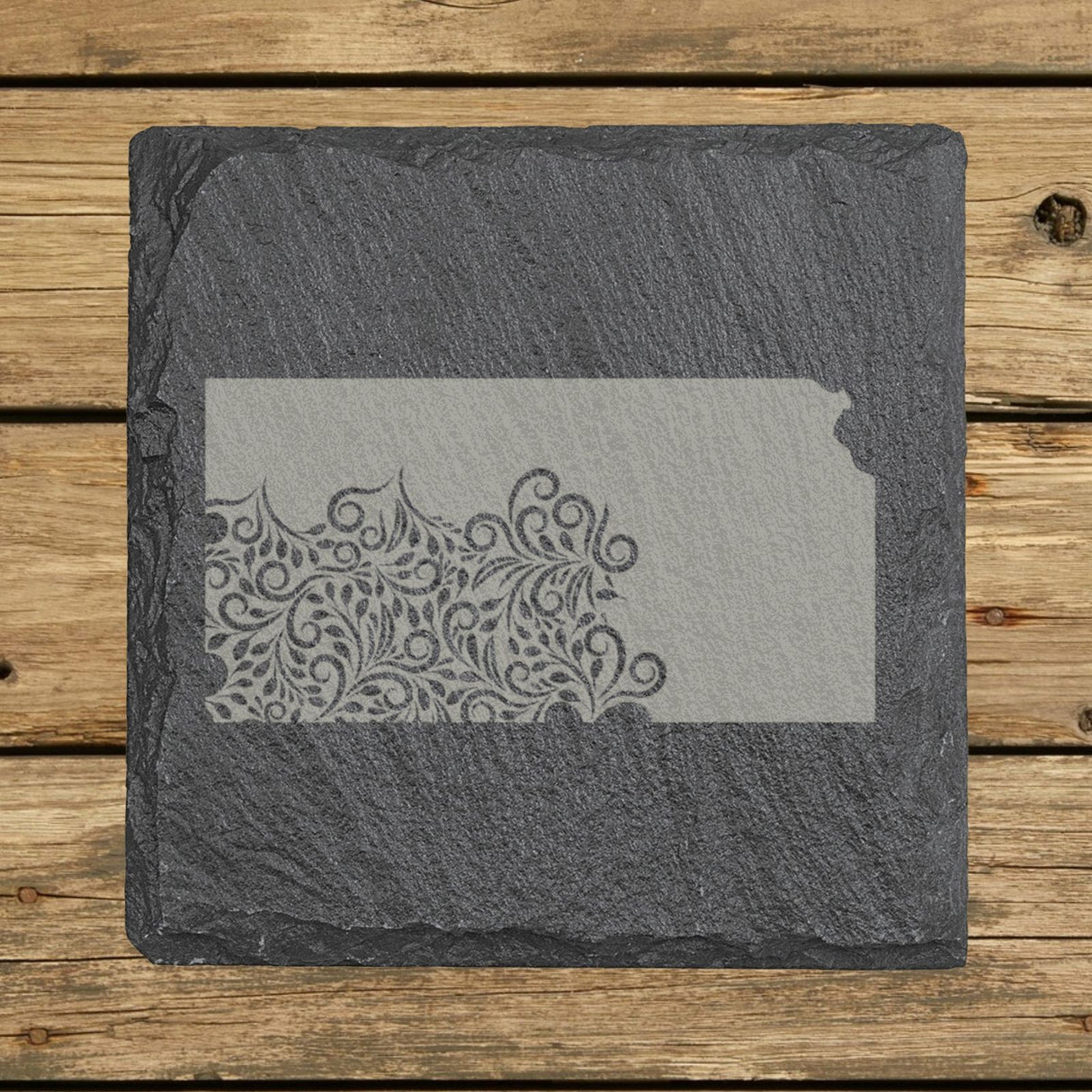 Kansas square slate coaster engraved with the state shape in ornate floral scrollwork