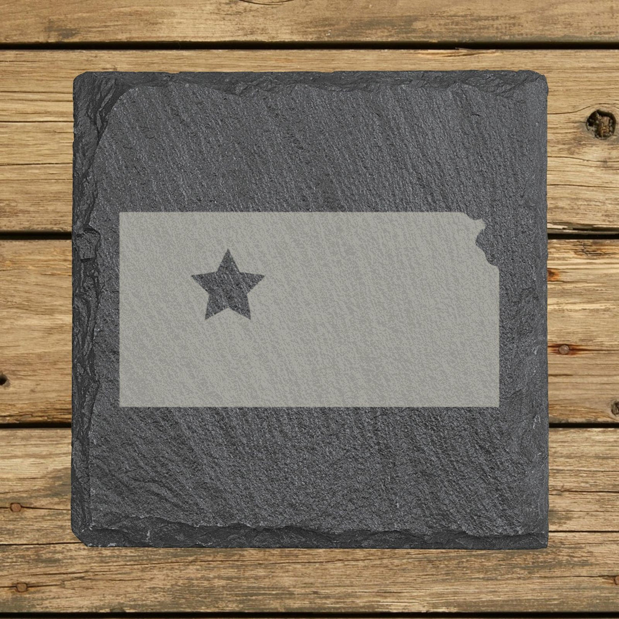 Kansas square slate coaster engraved with the state shape and a star