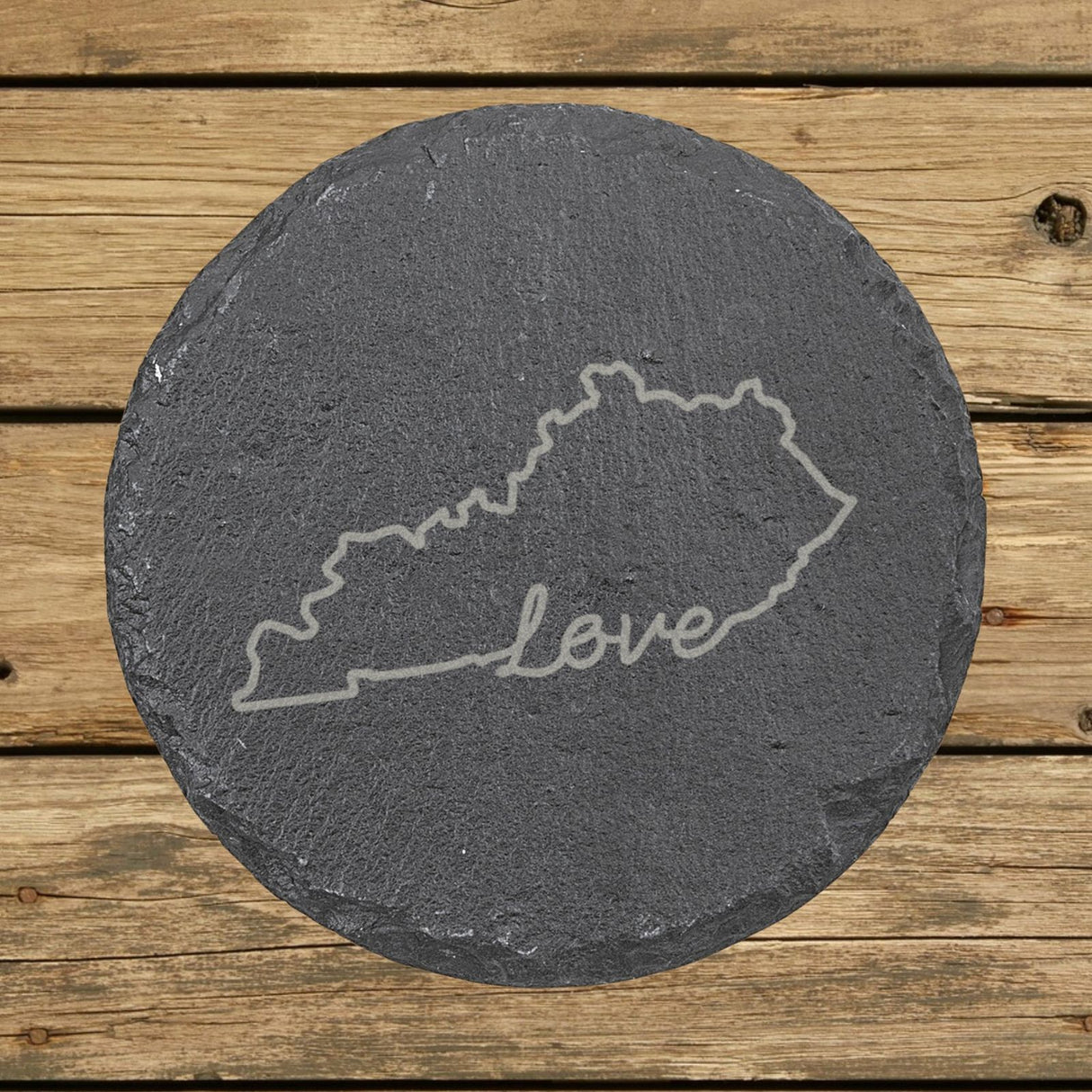 Kentucky round slate coaster engraved with a hand-drawn state outline and love in cursive