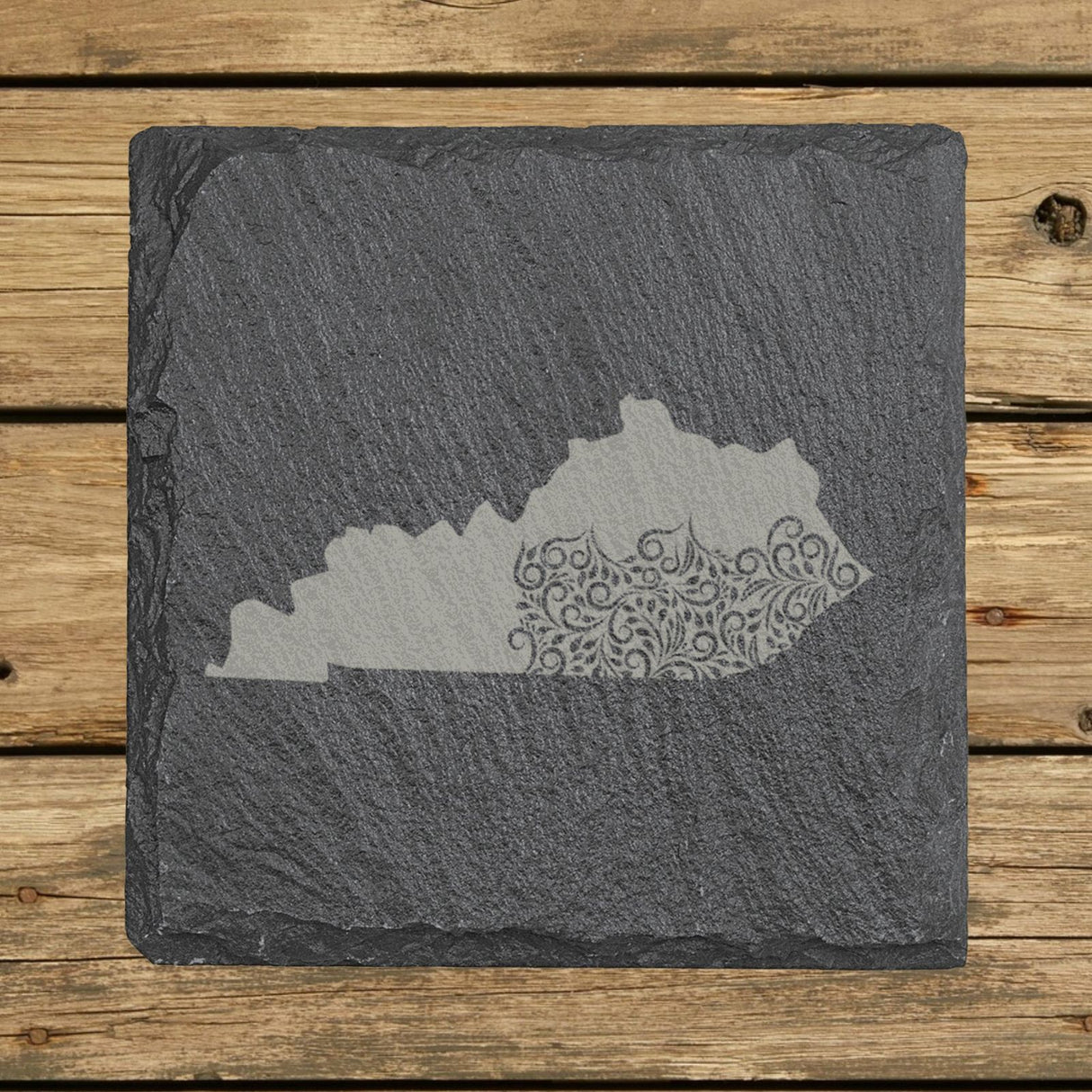 Kentucky square slate coaster engraved with the state shape in ornate floral scrollwork