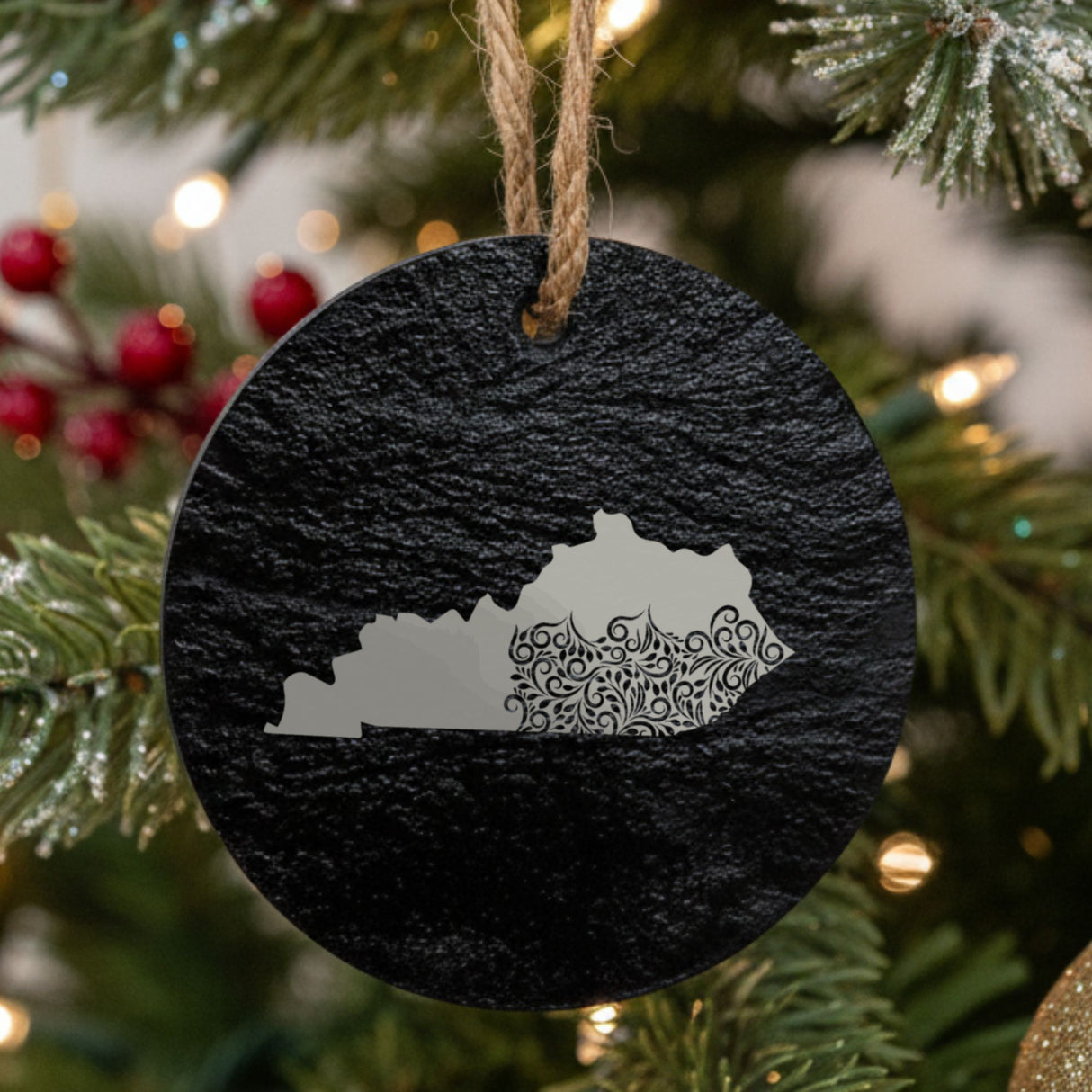 Kentucky round slate Christmas ornament engraved with the state shape in ornate floral scrollwork