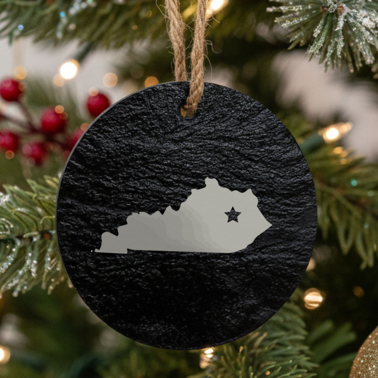 Kentucky round slate Christmas ornament engraved with the state shape and a star