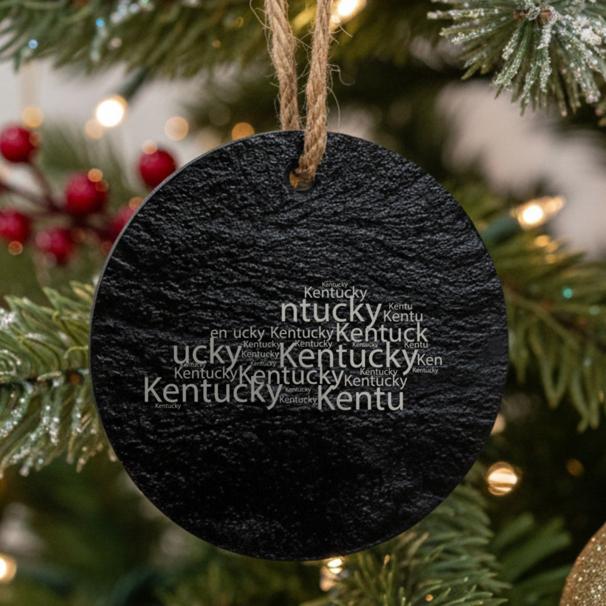 Kentucky round slate Christmas ornament engraved with a word cloud of repeating Kentucky text