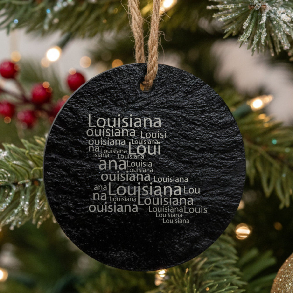 Louisiana round slate Christmas ornament engraved with a word cloud of repeating Louisiana text