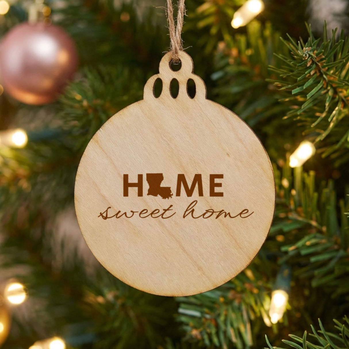 Louisiana round wood Christmas ornament engraved with HOME sweet home using the state shape as the letter O