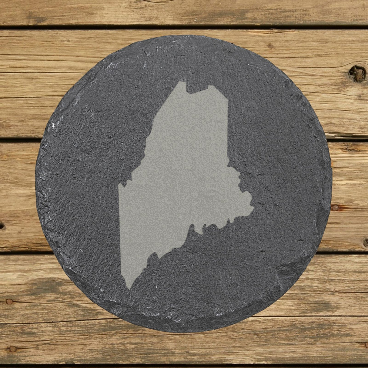 Maine round slate coaster with the full state shape engraved