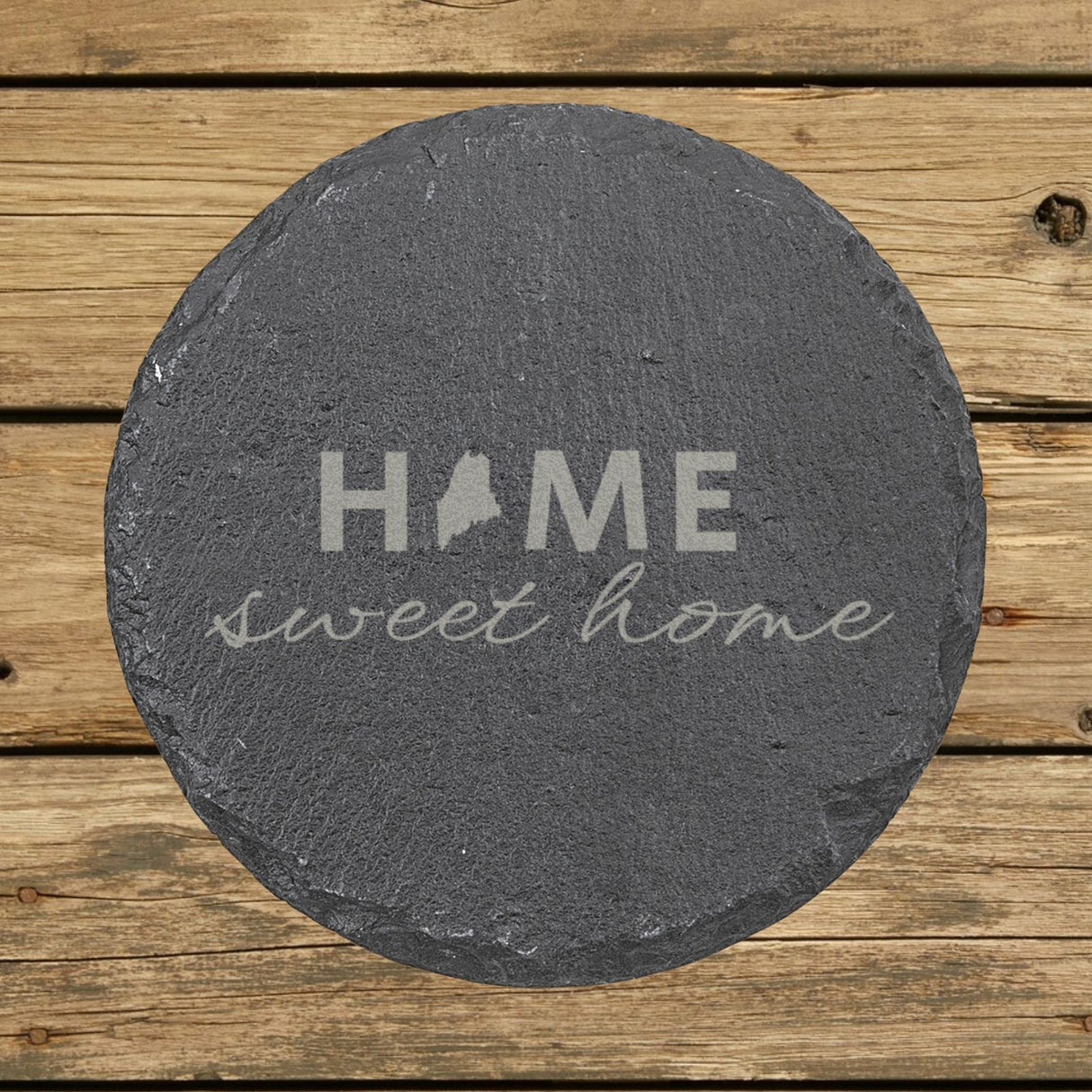 Maine round slate coaster engraved with HOME sweet home using the state shape as the letter O