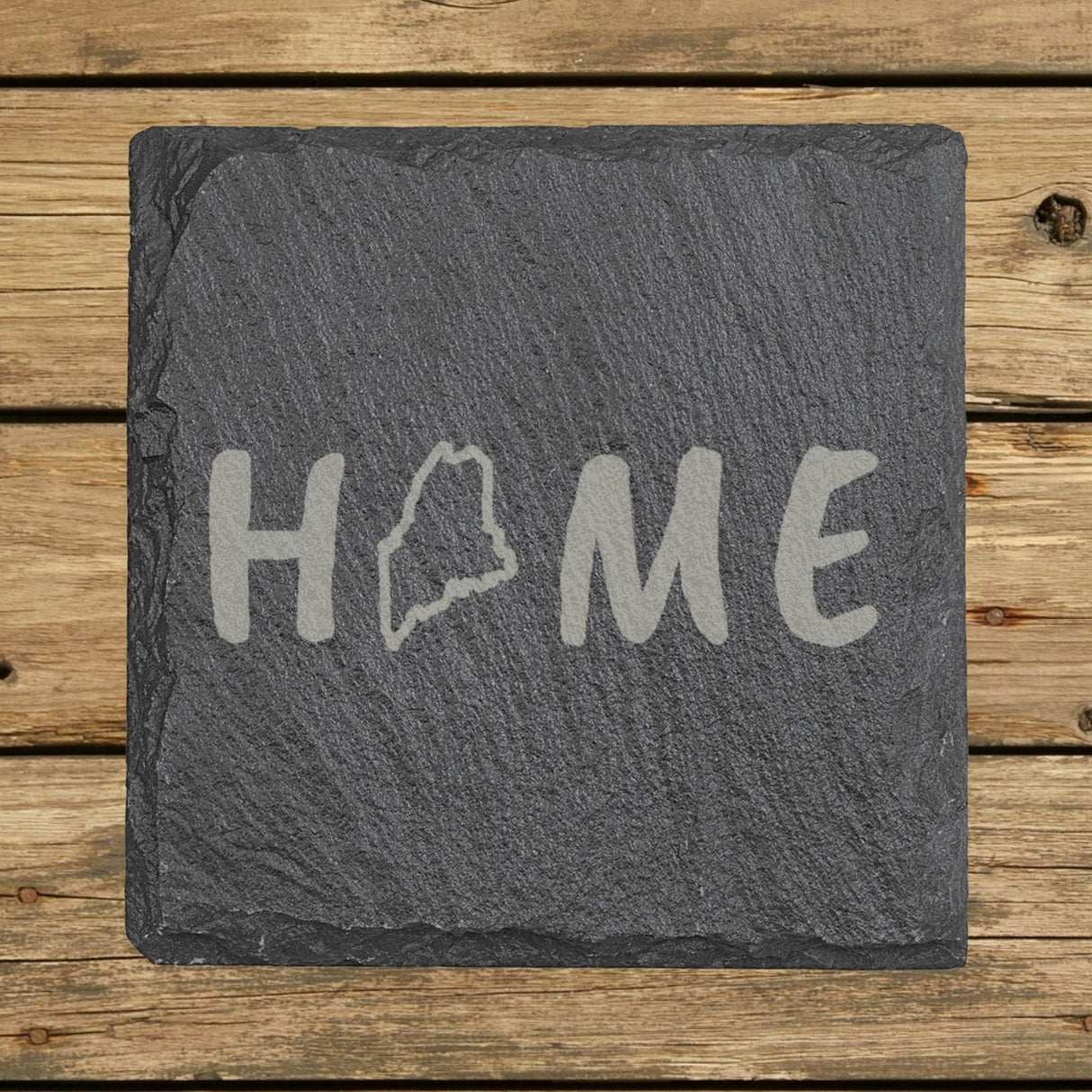 Maine square slate coaster engraved with HOME using the state outline as the letter O