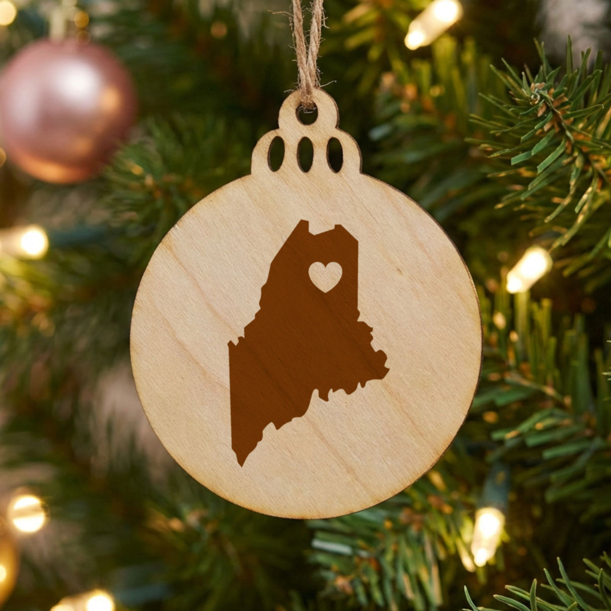 Maine round wood Christmas ornament engraved with the state shape and a heart